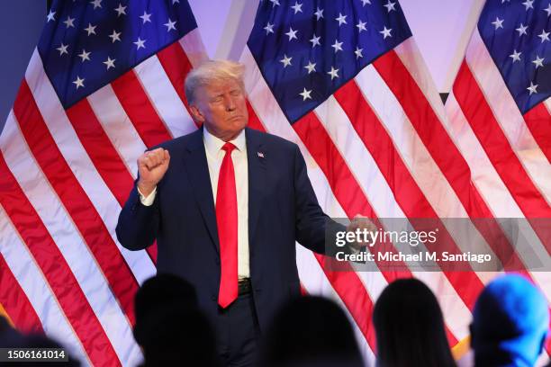 Republican presidential candidate former U.S. President Donald Trump dances after speaking at the Moms for Liberty Joyful Warriors national summit at...