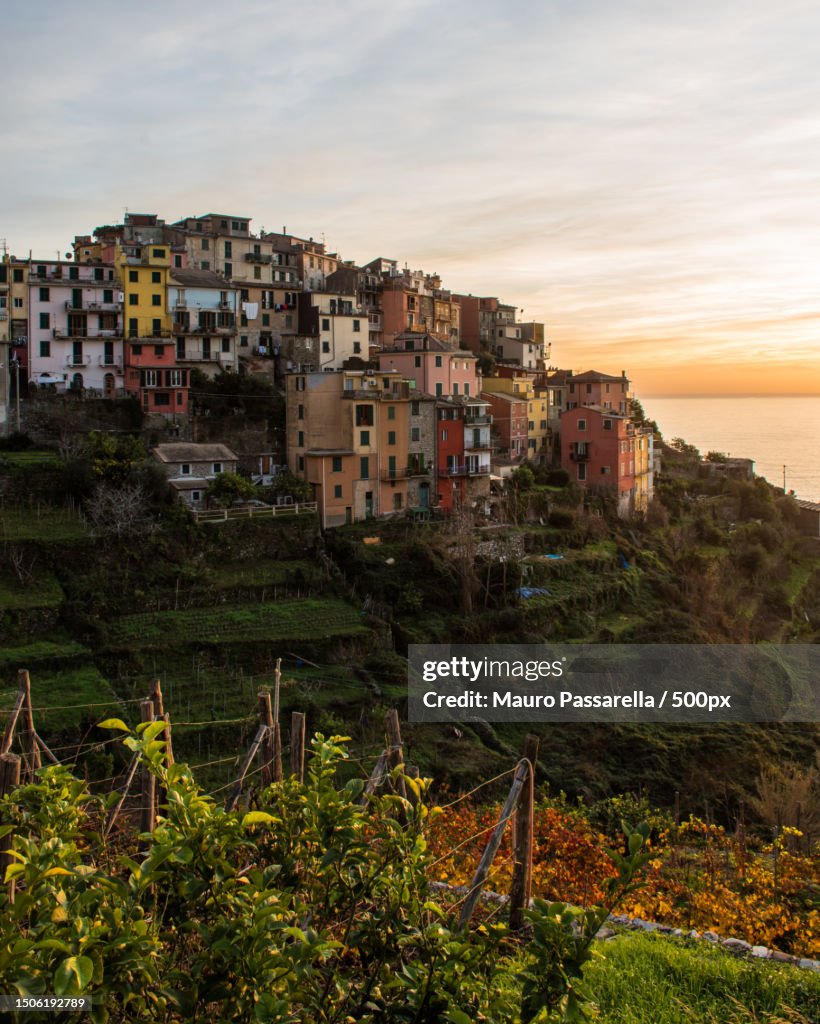 Scenic view of sea by buildings against sky,Corniglia,La Spezia,Italy