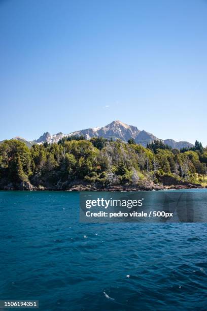 scenic view of sea against clear blue sky,bariloche,argentina - bariloche stock pictures, royalty-free photos & images