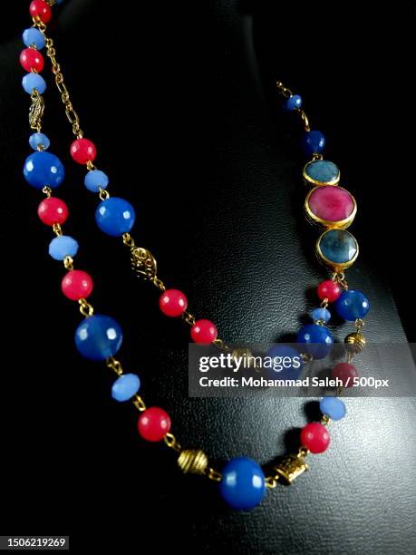 close-up of jewelry against black background - necklace stock pictures, royalty-free photos & images