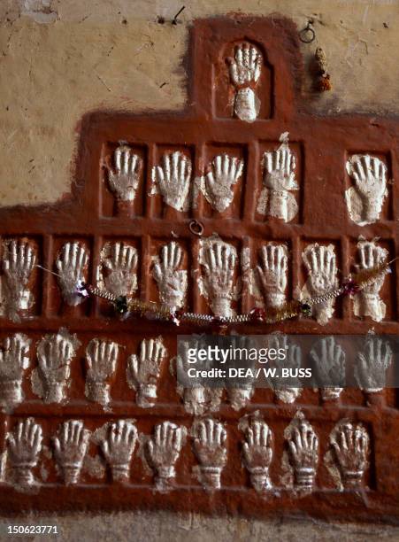 Memorial Sati Relief with imprints of the hands of Maharaja Man Singh's wives Mehrangarh Fort, Jodhpur, India.