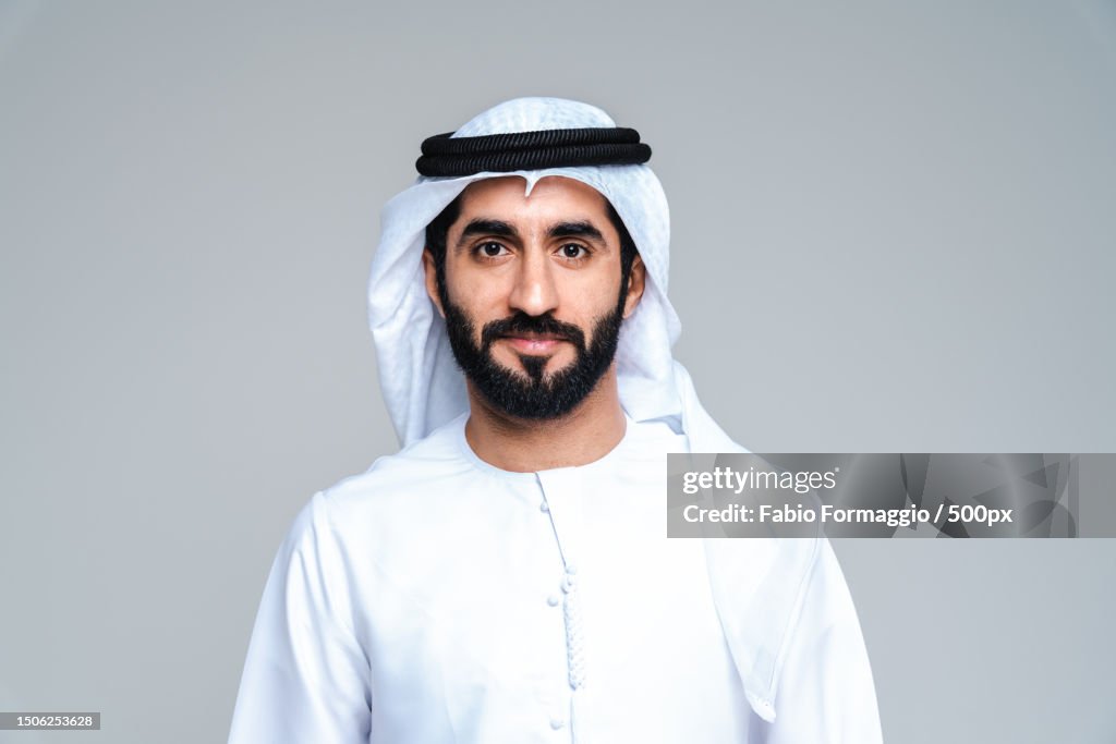 Handsome arab middle-eastern man with traditional kandora portrait in studio,United Arab Emirates