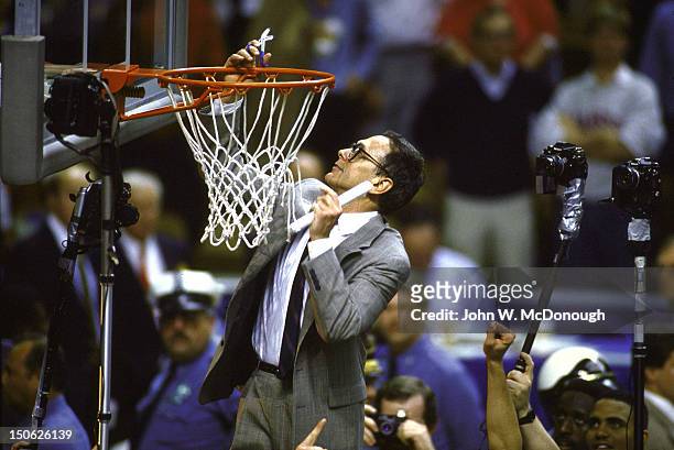 Final Four: Kansas coach Larry Brown on victorious cutting down net after winning championship vs Oklahoma at Kemper Arena. Kansas City, MO 4/3/1988...