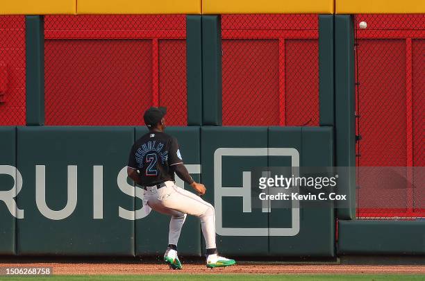 Jazz Chisholm Jr. #2 of the Miami Marlins chases down a RBI double hit by Austin Riley of the Atlanta Braves in the first inning at Truist Park on...