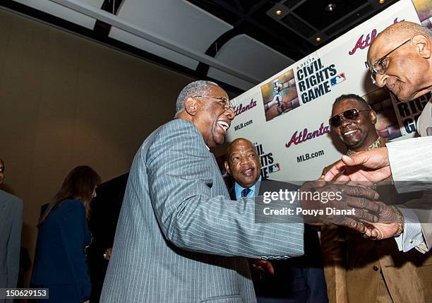 Hall of Famer Hank Aaron greets former MLB player Don Newcombe at the 2012 MLB Beacon Awards Luncheon presented by Belk during the Delta Civil Rights...