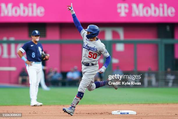 Mookie Betts of the Los Angeles Dodgers celebrates after hitting a solo home run in the first inning against the Kansas City Royals at Kauffman...