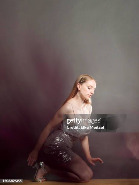 young woman in sequin dress dancing - kitten heel stock pictures, royalty-free photos & images