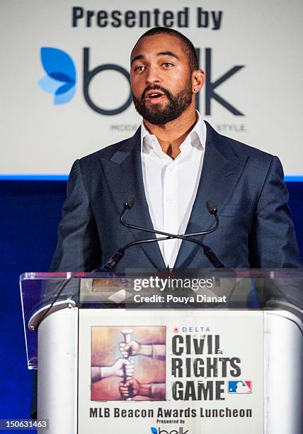Matt Kemp of the Los Angeles Dodgers presents the Beacon of Hope award to former MLB player Don Newcombe at the 2012 MLB Beacon Awards Luncheon...