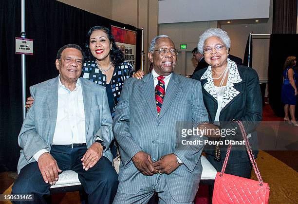 Andrew Young, Carolyn Young, Hall of Famer Hank Aaron and Billie Aaron pose for a photo at the 2012 MLB Beacon Awards Luncheon presented by Belk...