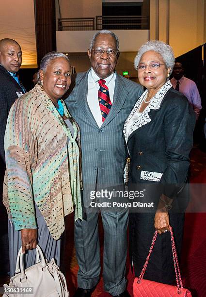 Sharon Robinson, Hall of Famer Hank Aaron and Billie Aaron pose for a photo at the 2012 MLB Beacon Awards Luncheon presented by Belk during the Delta...