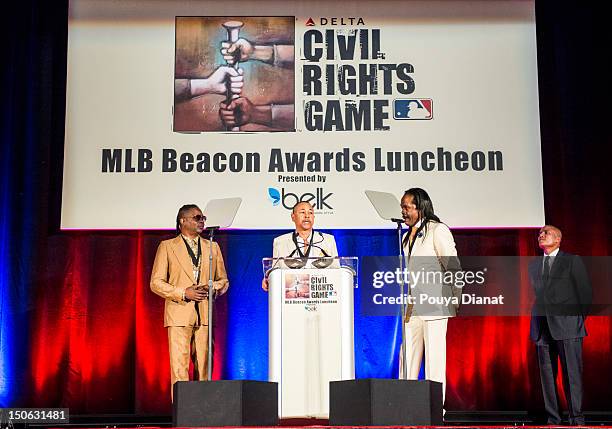 Earth, Wind & Fire members Phillip Bailey, Ralph Johnson and Verdine White accept the Beacon of Change award presented by Paxton Baker at the 2012...