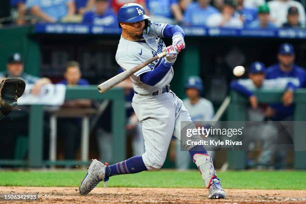 Mookie Betts of the Los Angeles Dodgers hits an RBI single during the fourth inning against the Kansas City Royals at Kauffman Stadium on June 30,...