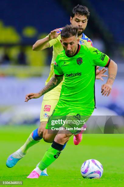 Nestor Araujo of America fights for the ball with Aitor Garcia of Juarez during the 1st round match between America and FC Juarez as part of the...