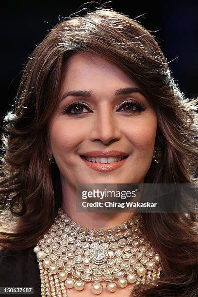 Madhuri Dixit walks the runway at the PCJ Grand Finale show of India International Jewellery Week 2012 day 5 at the Grand Hyatt on August 23, 2012 in...
