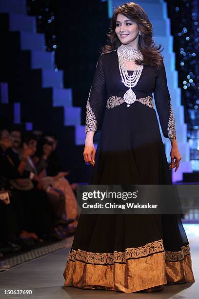 Madhuri Dixit walks the runway at the PCJ Grand Finale show of India International Jewellery Week 2012 day 5 at the Grand Hyatt on August 23, 2012 in...