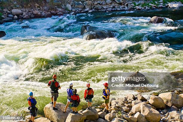 caucasian family standing near rapids in river - kayaking rapids stock pictures, royalty-free photos & images