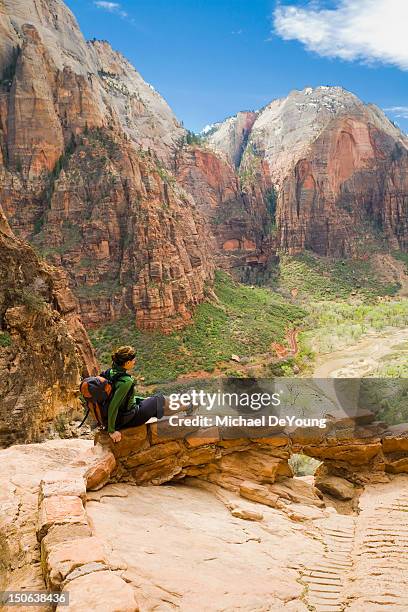 persian woman sitting on canyon path - utah nature stock pictures, royalty-free photos & images