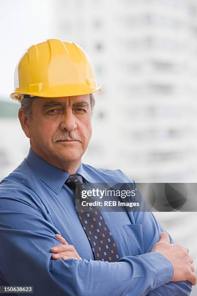 hispanic businessman wearing hard hat - chilean ethnicity stock pictures, royalty-free photos & images