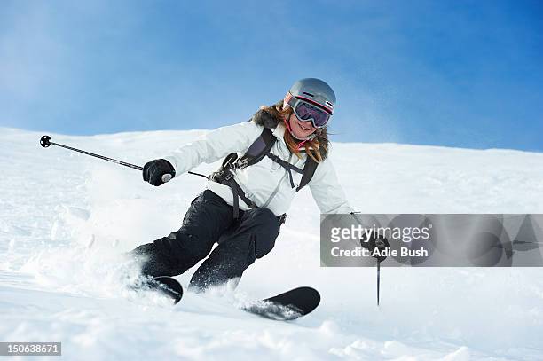 skier skiing on snowy slope - female bush photos stock pictures, royalty-free photos & images