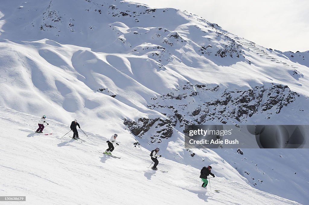 Skiers skiing together on slope