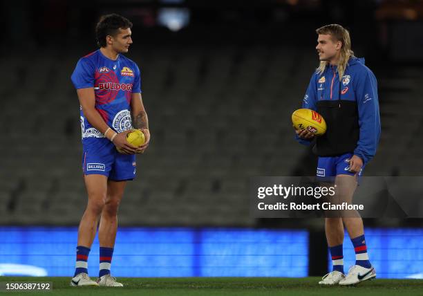 Jamarra Ugle-Hagan and Bailey Smith of the Bulldogs are seen prior to the round 16 AFL match between Western Bulldogs and Fremantle Dockers at Marvel...