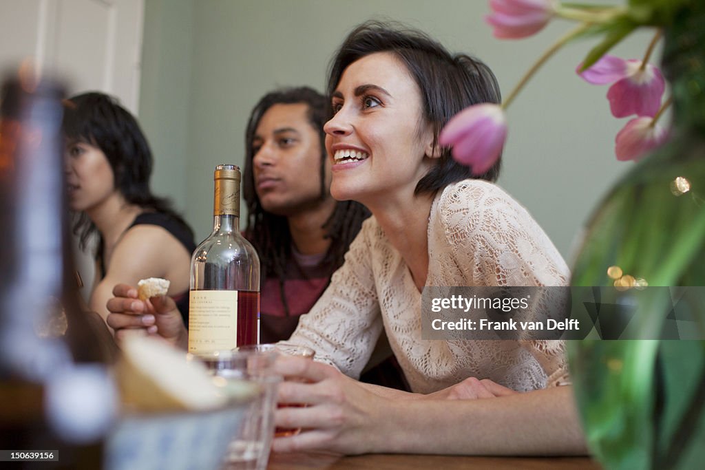 Woman talking at dinner table