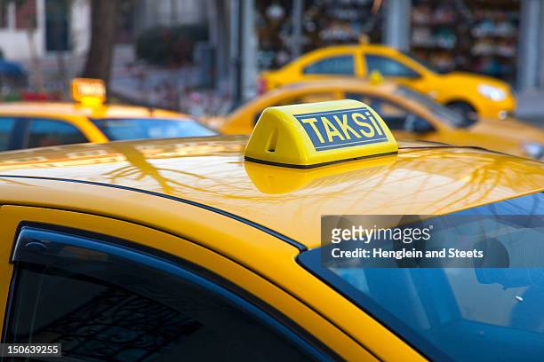 close up of turkish taxi sign - yellow taxi fotografías e imágenes de stock