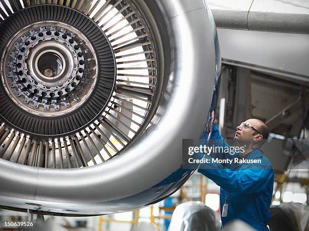 aircraft engineer working on 737 jet engine in airport - airline industry stock-fotos und bilder
