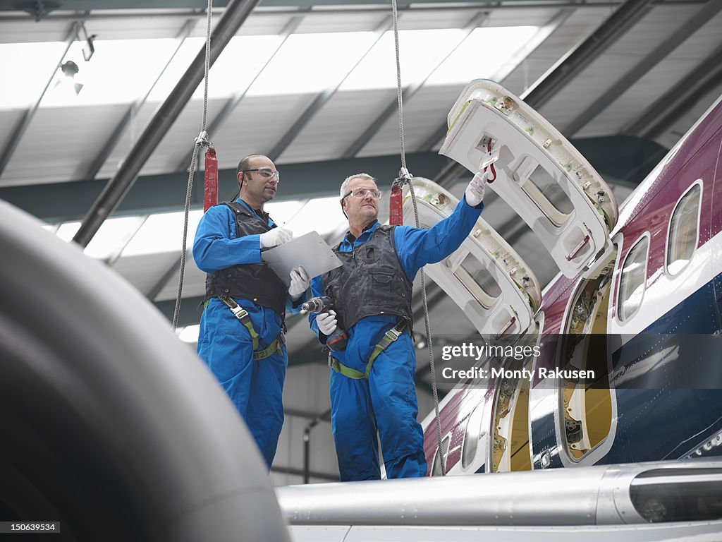 Flight Engineer Work Aircraft Engineers Working On Wing Of 737 Jet Airplane In Airport High ...