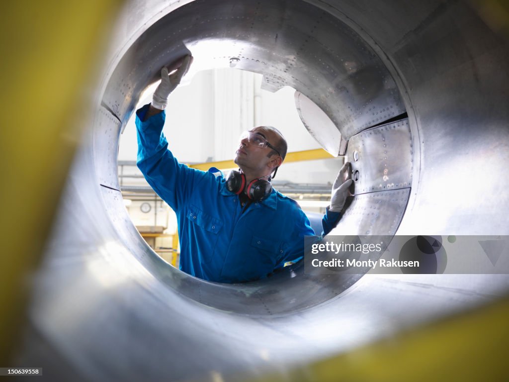 Aircraft engineer inspecting reverse thruster of 737 jet engine