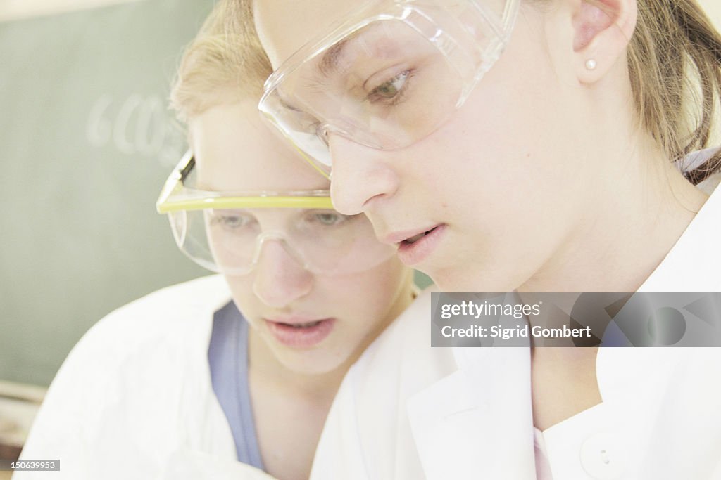 Students wearing safety goggles in lab