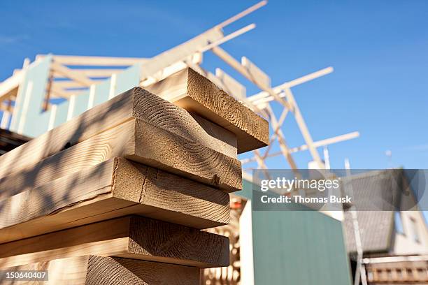 close up of stacked wood on site - building house stockfoto's en -beelden