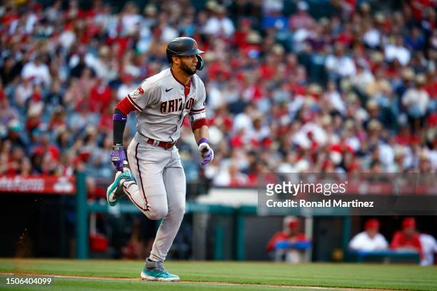 Lourdes Gurriel Jr. #12 of the Arizona Diamondbacks hits a infield single against the Los Angeles Angels in the first inning at Angel Stadium of...
