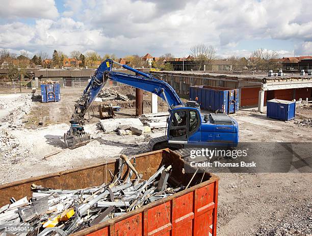 digger at work at construction site - demolition expert stock pictures, royalty-free photos & images
