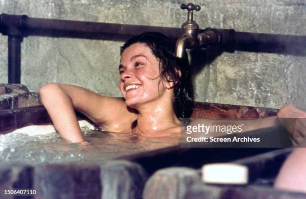 Canadian actress Geneviève Bujold in a bath tub, circa 1975.