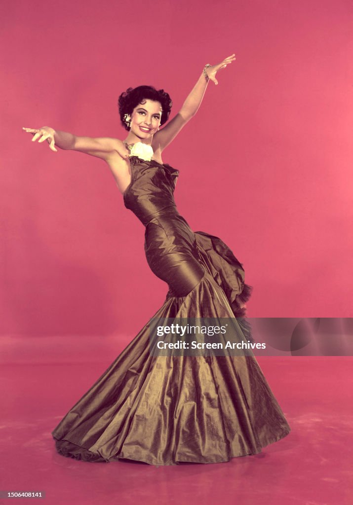 Cyd American actress and dancer Cyd Charisse in a ballgown, circa 1957 ...
