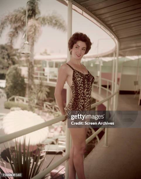 Argentinian actress Linda Cristal wearing a leopard print swimsuit, 1958.