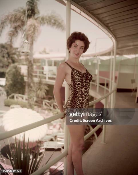 Argentinian actress Linda Cristal wearing a leopard print swimsuit, 1958.