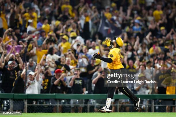 Carlos Santana of the Pittsburgh Pirates celebrates after hitting a walk off home run to beat the Milwaukee Brewers 8-7 at PNC Park on June 30, 2023...