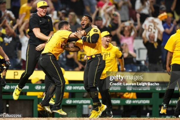 Tucupita Marcano of the Pittsburgh Pirates and Rodolfo Castro celebrate after Carlos Santana hit a walk off home run to beat the Milwaukee Brewers...