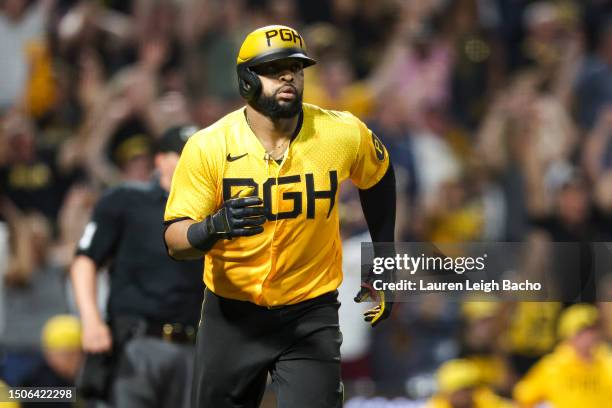 Carlos Santana of the Pittsburgh Pirates hits a walk off home run to beat the Milwaukee Brewers 8-7 at PNC Park on June 30, 2023 in Pittsburgh,...