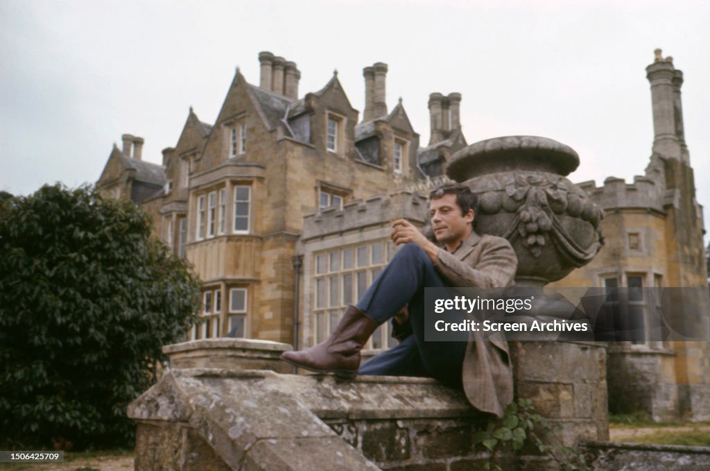 English actor Oliver Reed in the grounds of his Country estate circa ...