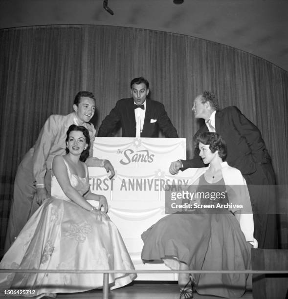 Vic Damone, Joan Evans and Van Heflin celebrate the world famous Sands Hotel and Casino first anniversary in Las Vegas, Nevada, 1953.