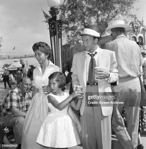 Frank Sinatra with his daughters Nancy and Tina, circa 1956.