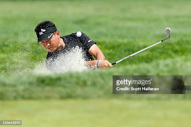 Choi of South Korea hits a shot out of the bunker on the ninth hole during the First Round of The Barclays on the Black Course at Bethpage State Park...