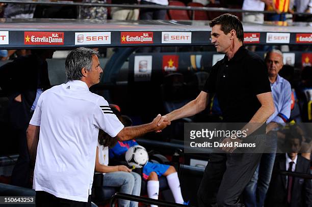 Head coach Jose Mourinho of Real Madrid and Head coach Tito Vilanova of FC Barcelona shake hands prior to the Super Cup first leg match between FC...