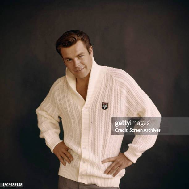 American actor Robert Wagner wearing large white sweater, circa 1958.