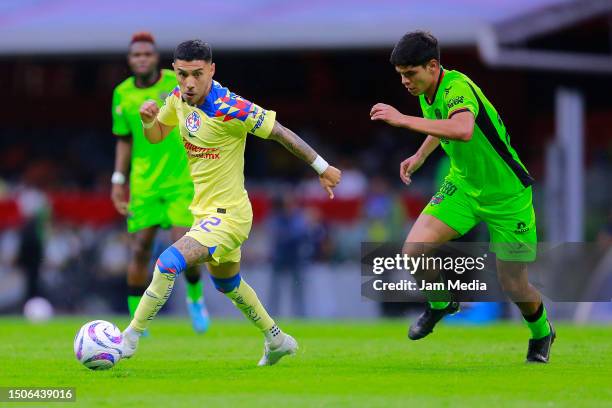 Leonardo Suarez of America fights for the ball with Cesar Sosa of Juarez during the 1st round match between America and FC Juarez as part of the...