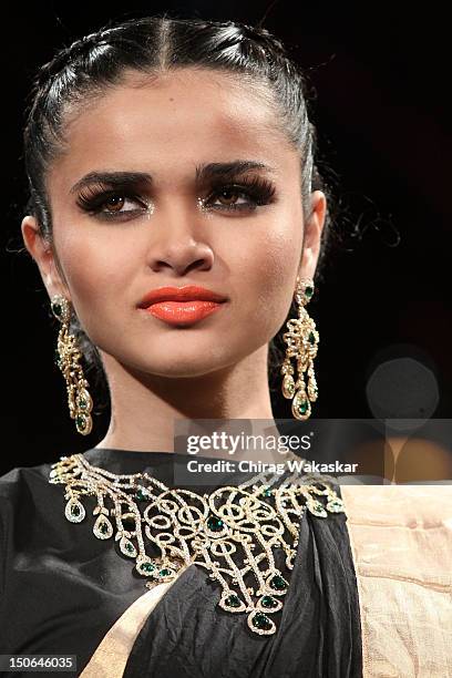 Model walks the runway at the PCJ Grand Finale show of India International Jewellery Week 2012 day 5 at the Grand Hyatt on August 23, 2012 in Mumbai,...