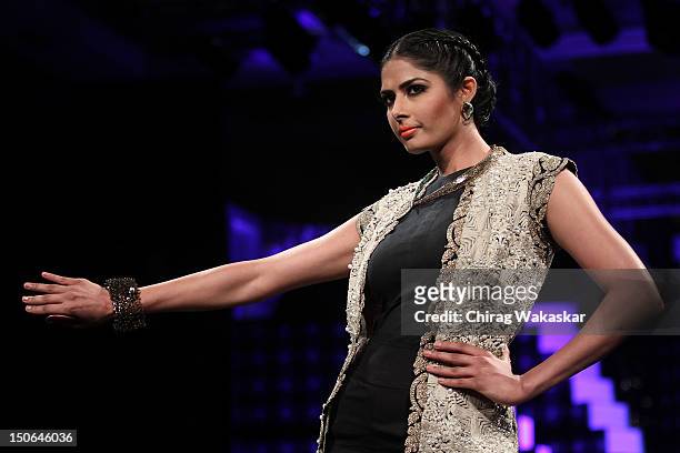 Model walks the runway at the PCJ Grand Finale show of India International Jewellery Week 2012 day 5 at the Grand Hyatt on August 23, 2012 in Mumbai,...